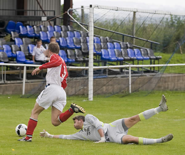 Jon Newton rounds the Ryton keeper